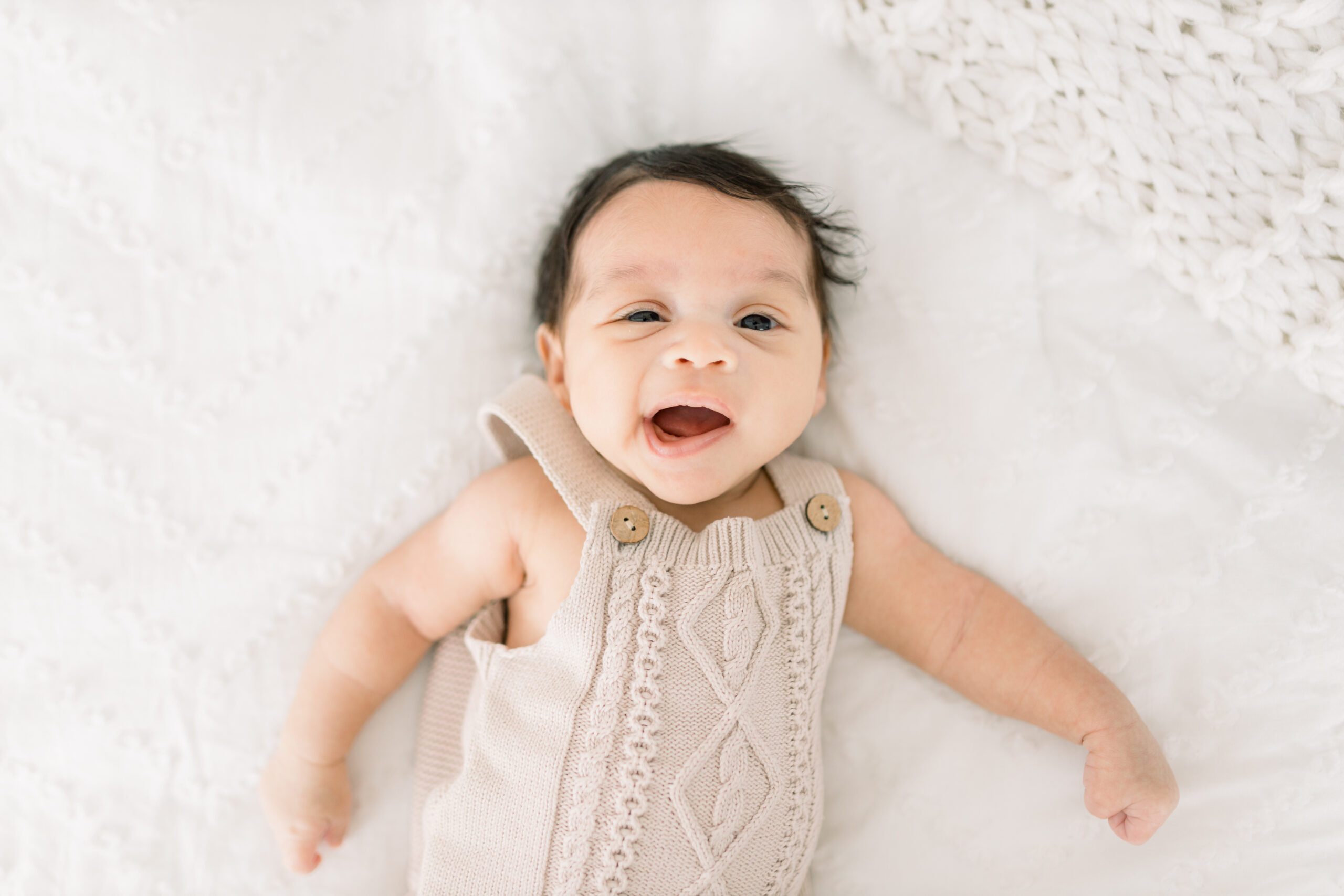Photo of smiling newborn by Ericka Ana Photography